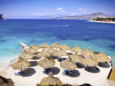 Sunshade umbrellas and deckchairs on the beautiful Ksamil beach, Albania.